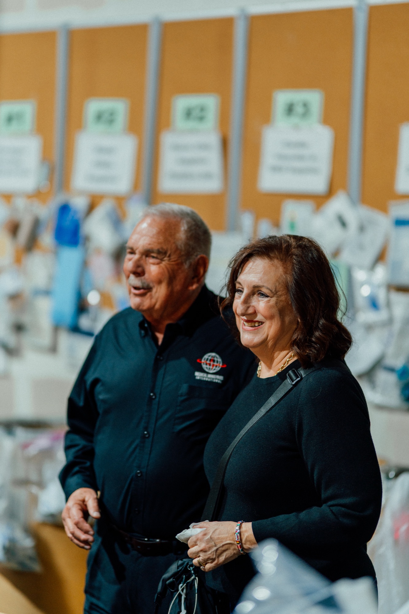 MMI founders Tom and Nancy Stoeckel smiling together in the warehouse