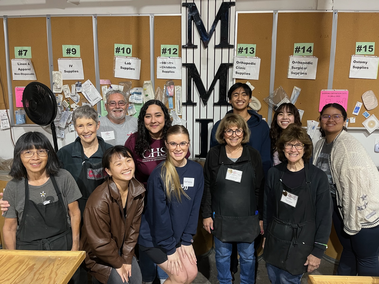 California Health Sciences University volunteers together at the MMI warehouse