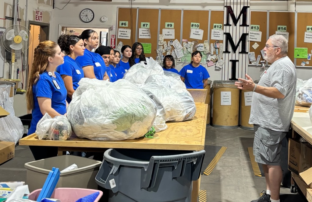 Sanger ROP medical assistant students listening to an instructor at the MMI warehouse