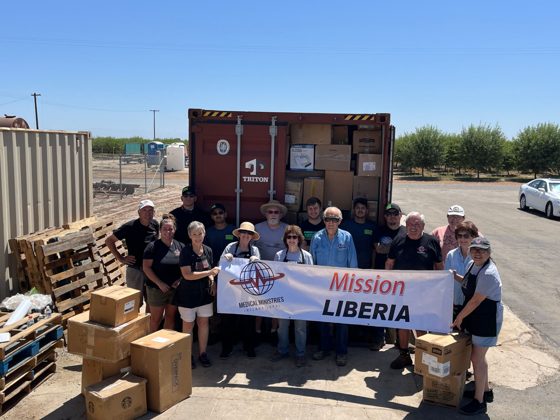 MMI shipping crew at the loaded Mission Liberia container